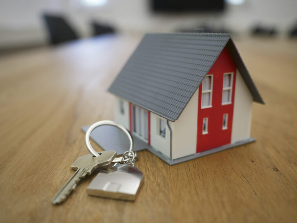 Model house and keys on a table